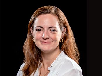 female research scientist director with brown hair at Kessler Foundation wearing a white blouse